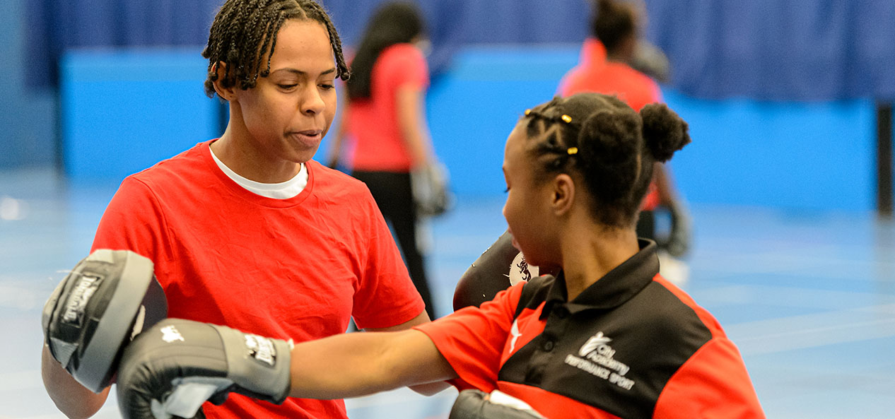 Two pupils in a boxing drill during a school PE lesson