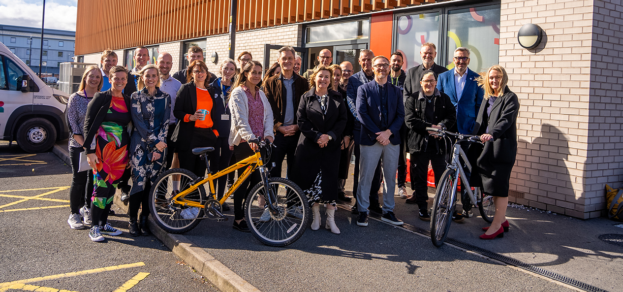 A group shot outside Leigh Bike Library in Greater Manchester with, among others, Sport England chair Tim Hollingsworth, executive director of place Lisa Dodd-Mayne and GM Moving chief executive Hayley Lever