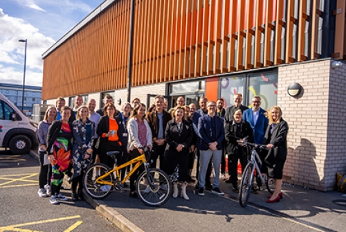 A group shot outside Leigh Bike Library in Greater Manchester with, among others, Sport England chair Tim Hollingsworth, executive director of place Lisa Dodd-Mayne and GM Moving chief executive Hayley Lever