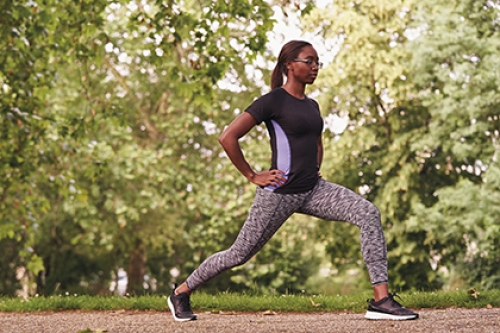 A woman stretching in the park