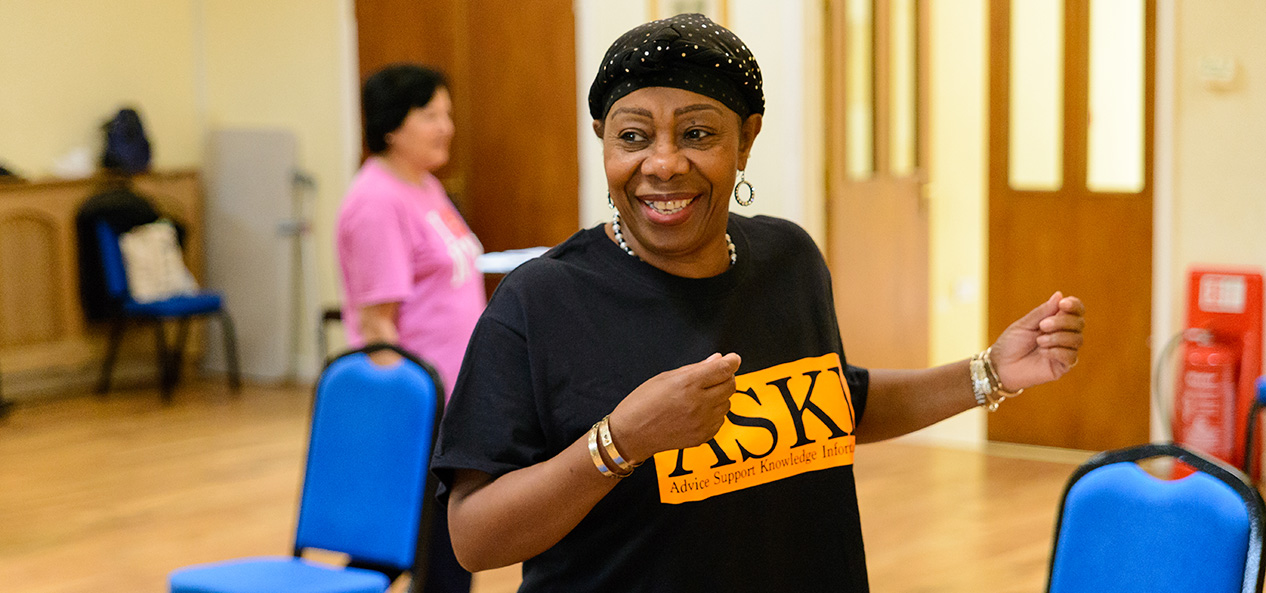 A woman dances in an aerobics class