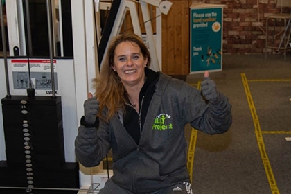 A member of The Billy Project poses for a photo at the gym