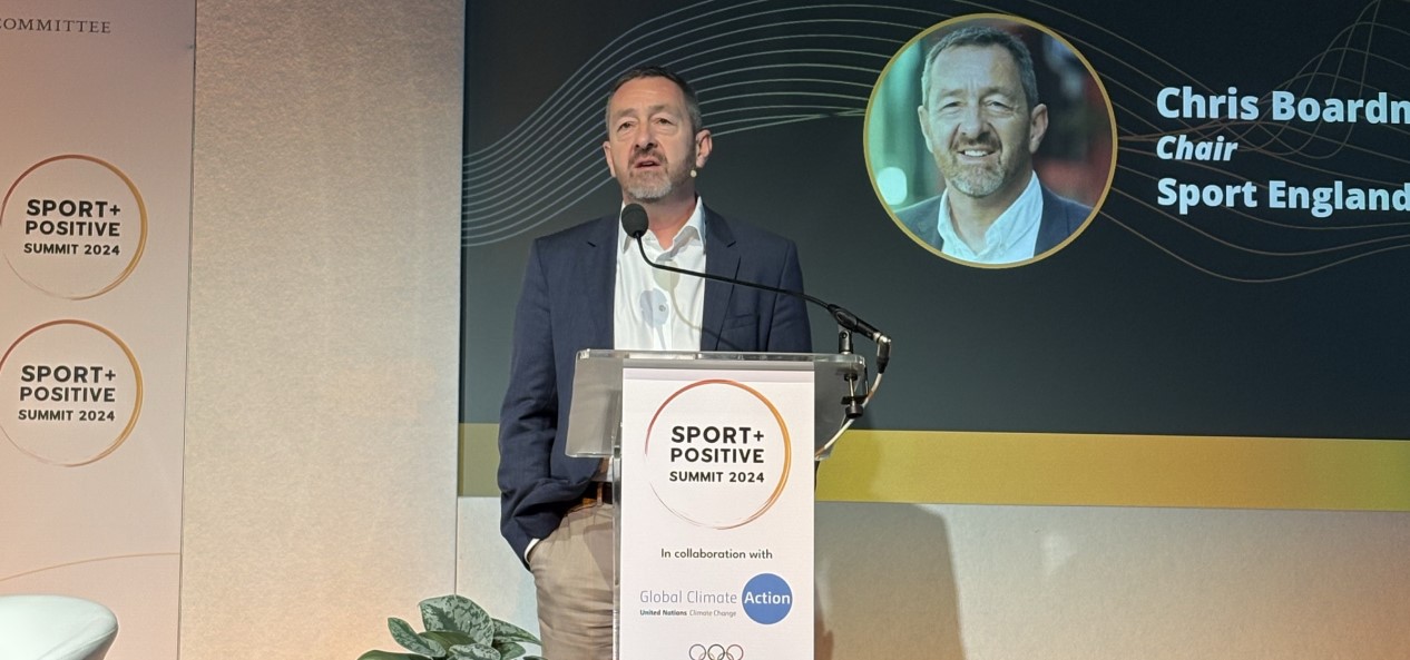 Chris Boardman speaks at a lecturn during the Sport Positive summit.