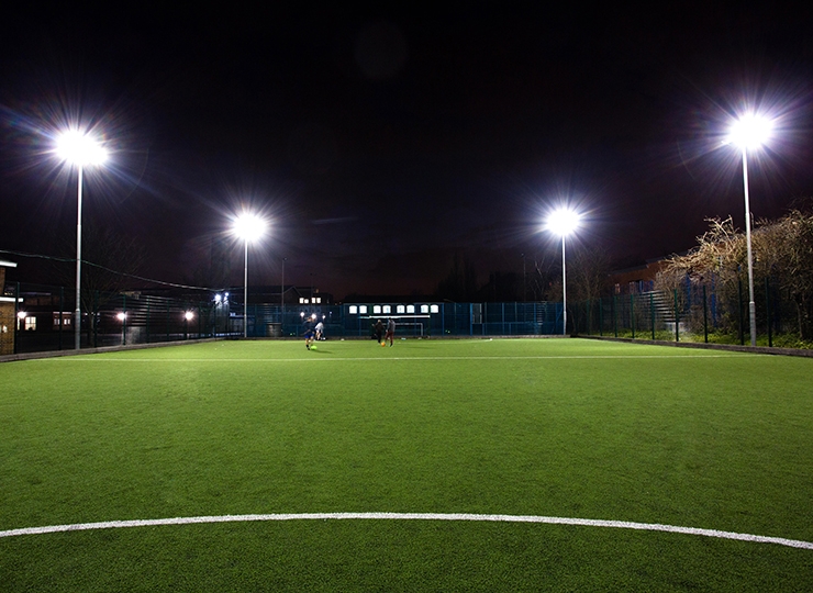 Floodlights on a 4G community football pitch