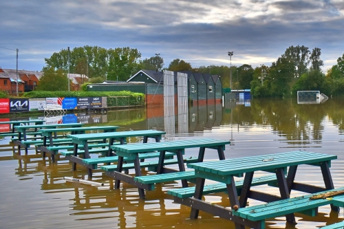 Picnic benches in water at Stony Stratford Cricket Club after flooding in September 2024.