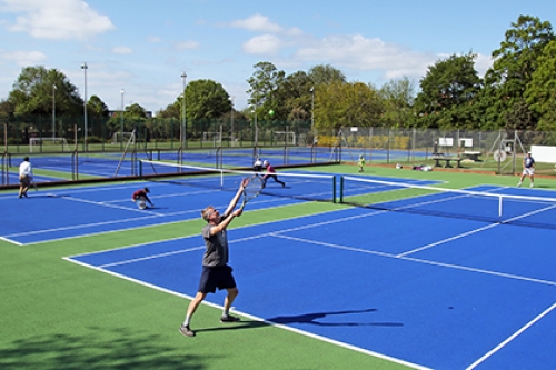 Tennis players on hard courts, after coronavirus restrictions are eased