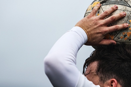 A footballer prepares to take a throw in