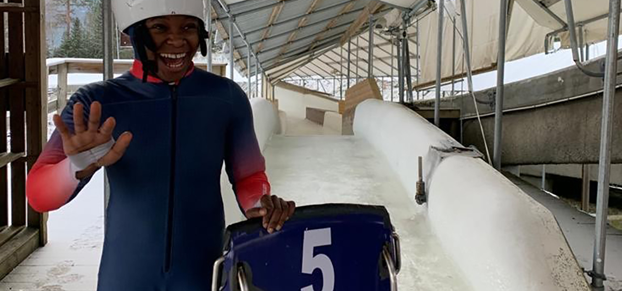 Skeleton slider Taiwo Eyiowuawi smiles and waves at the bottom of the skeleton run in Lillehammer