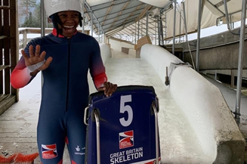 Skeleton slider Taiwo Eyiowuawi smiles and waves at the bottom of the skeleton run in Lillehammer