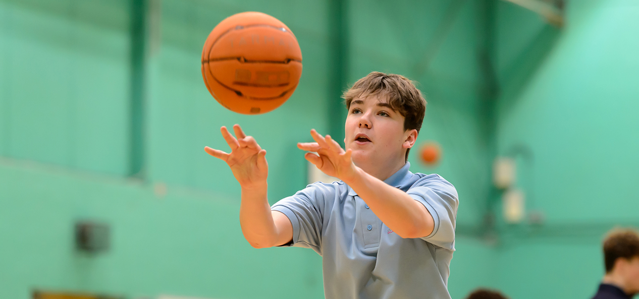 A boy playing basketball