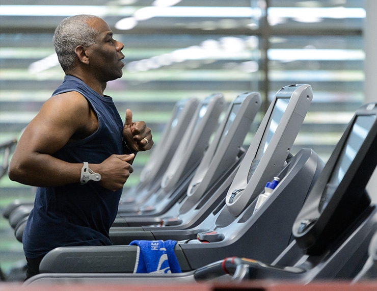 A man working out on a treadmill.