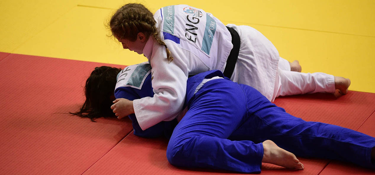 Two young athletes compete at judo