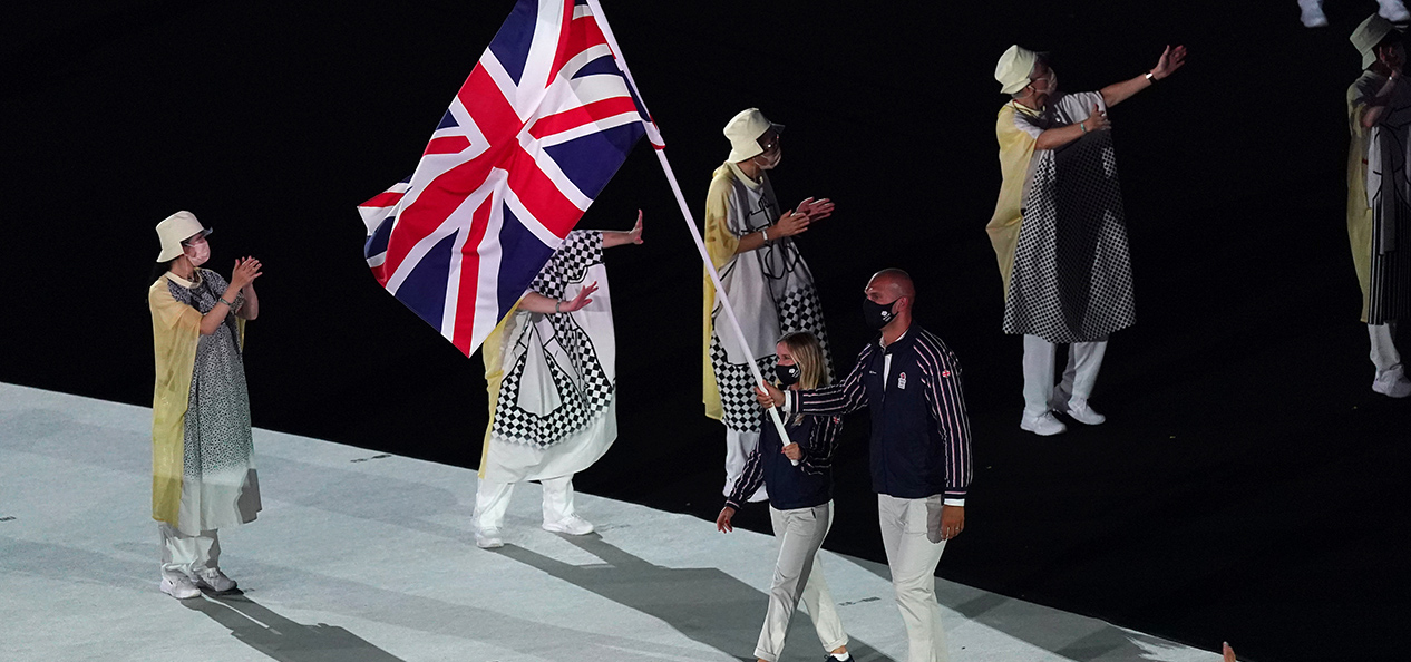 Hannah Mills and Mo Sbihi carry the Union Flag at the athletes' parade at the opening ceremony of the Tokyo 2020 Olympic Games