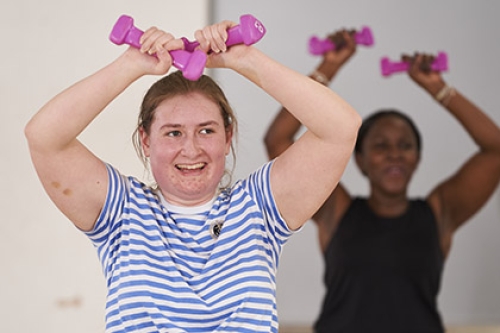 Two women working out at the gym