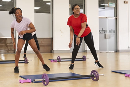 Two women working out in a fitness class