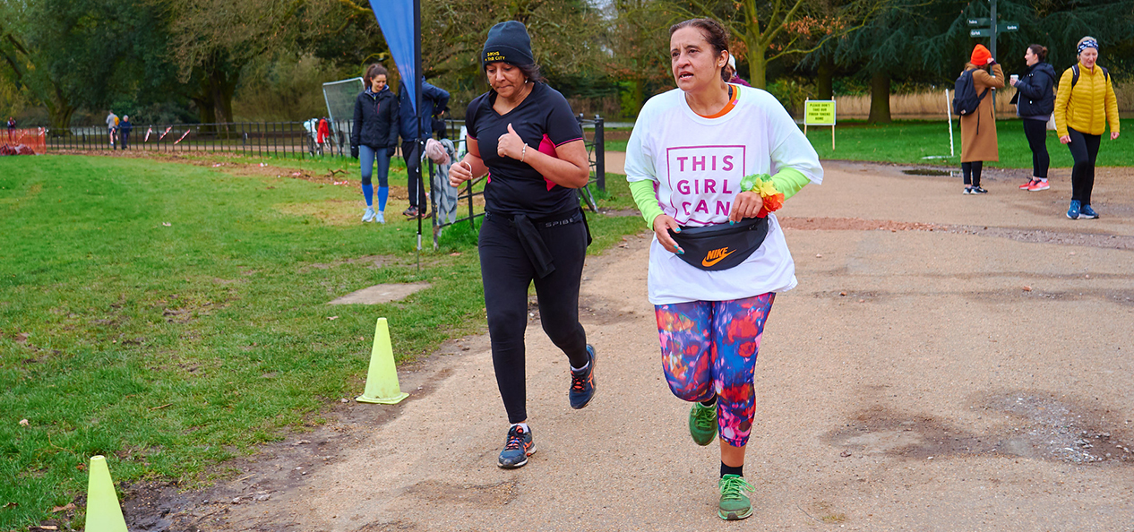 Two women, one wearing a This Girl Can t-shirt, take part in the first International Women's Day This Girl Can parkrun