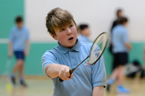A boy playing badminton
