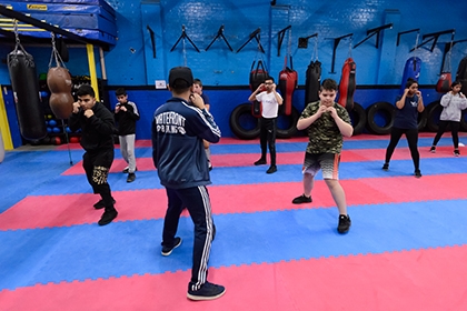 A group of young boxers warming up inside Waterfront Boxing Academy.