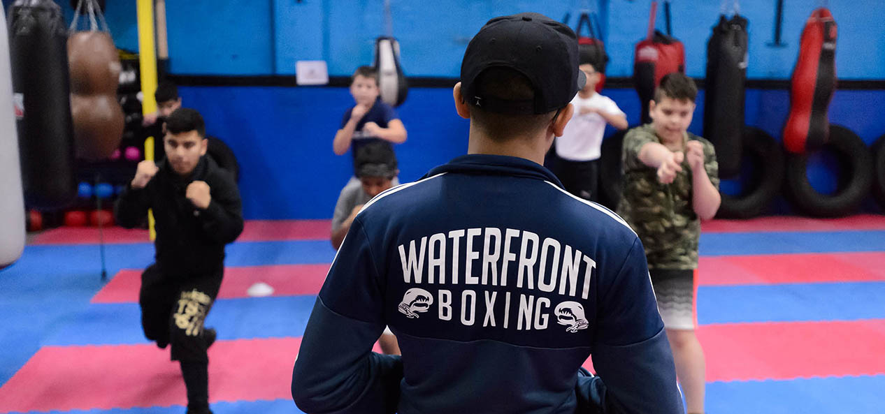 A coach at Waterfront puts some youngsters through their paces