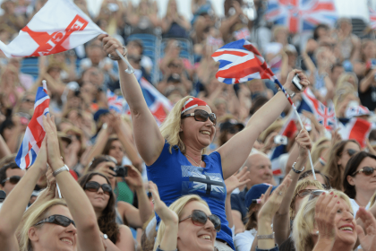 Audience cheering waving England flag