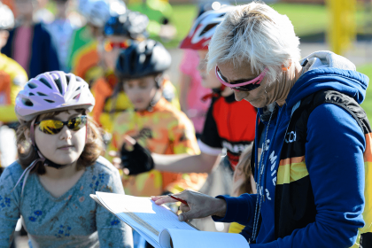 children signing up to a cycling event