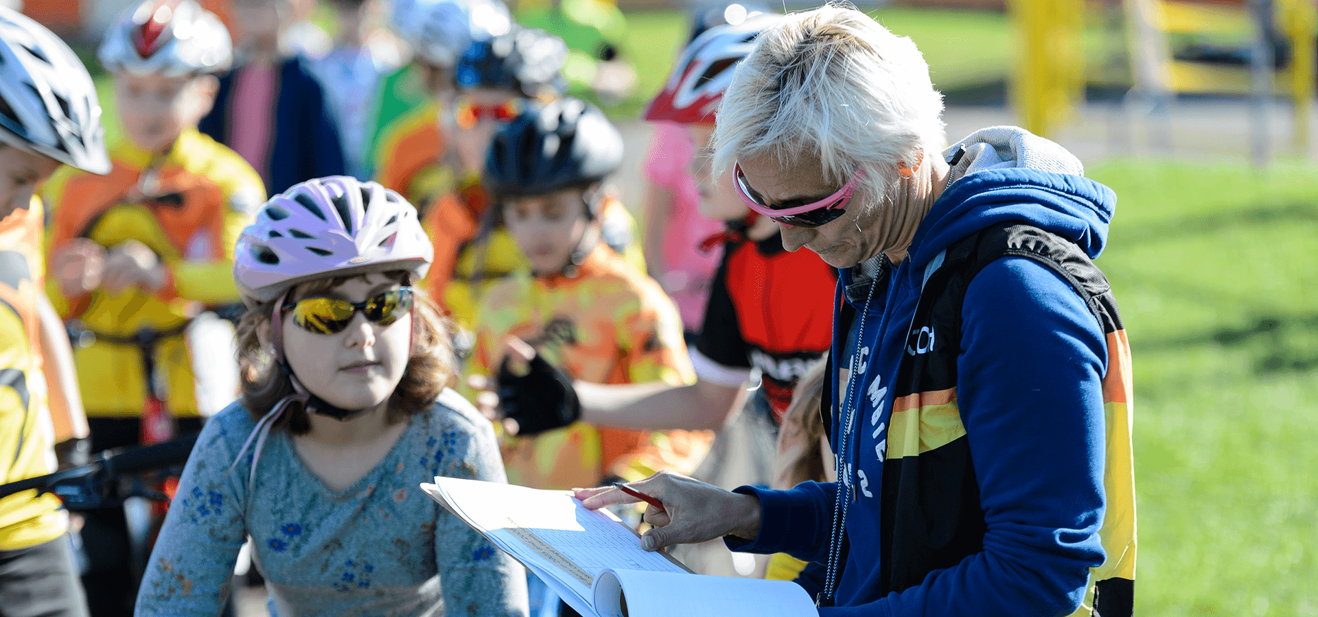 children signing up to a cycling event