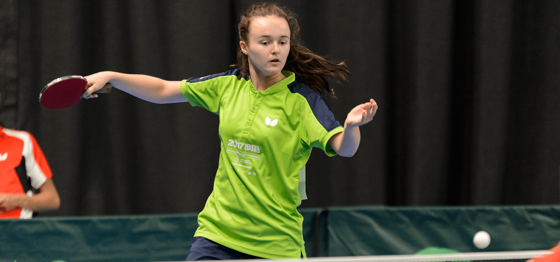 Girl playing indoor table tennis