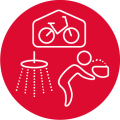 A pictogram in a red circle of a person drinking from a water fountain, secure bike storage and a shower