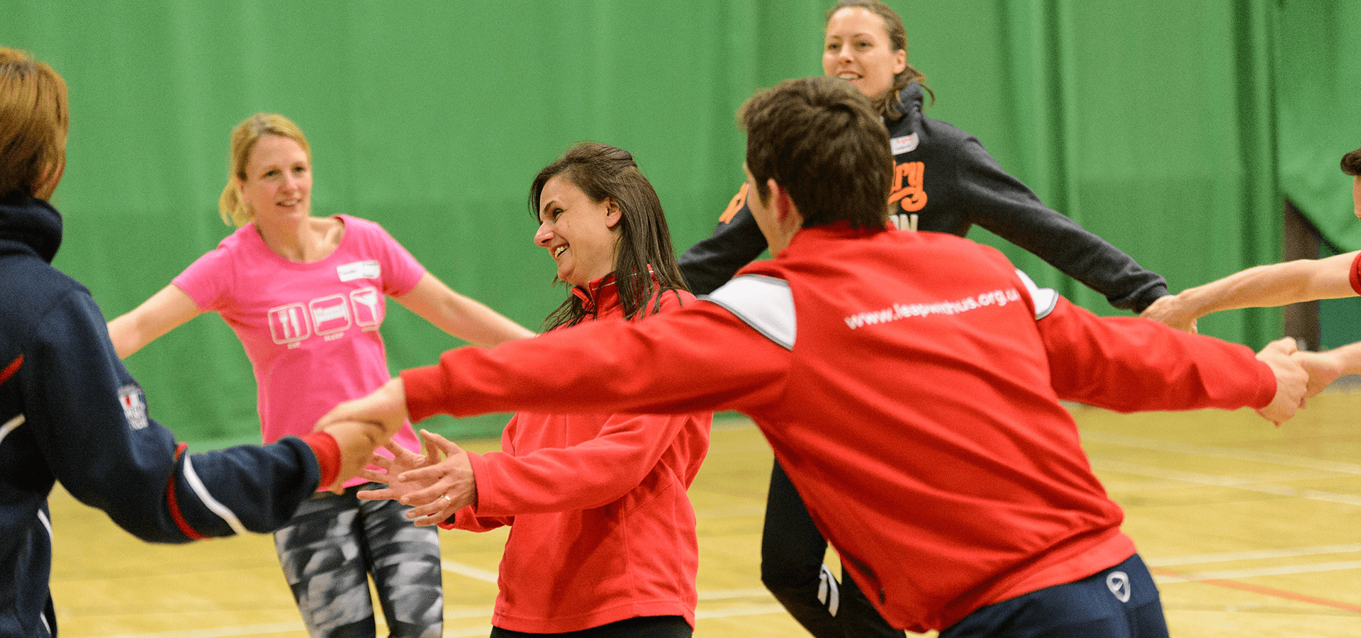 People doing group exercises indoors