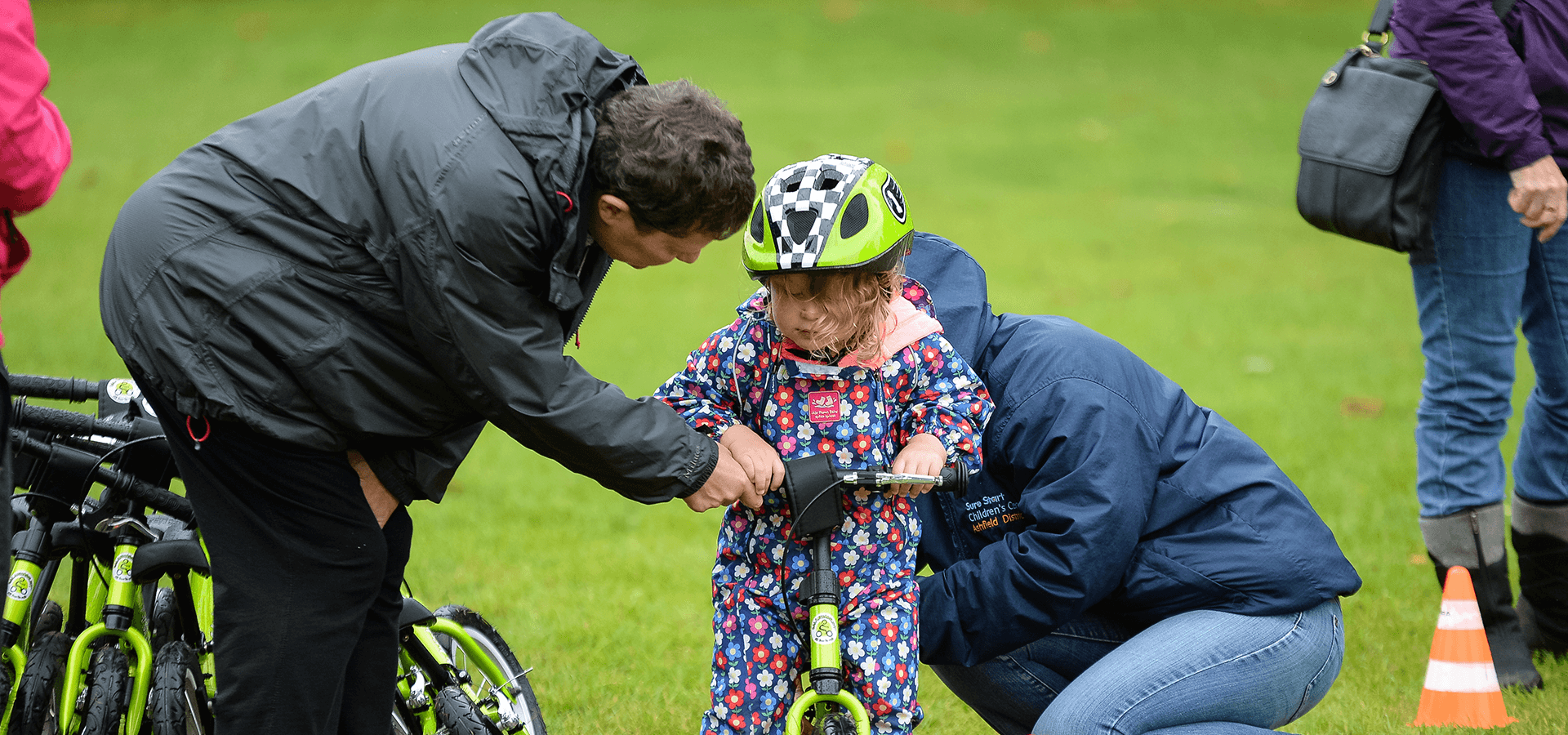 Safeguarding girl learning how to ride a bike