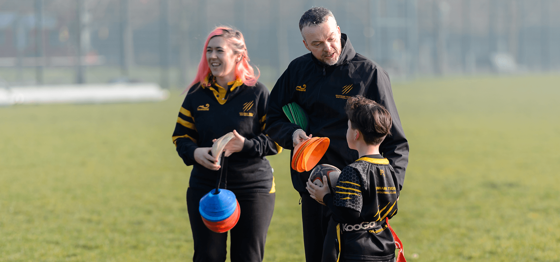 Volunteering rugby coaches helping out